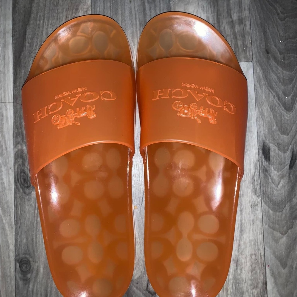 Orange coach slippers. Never worn. Size 6